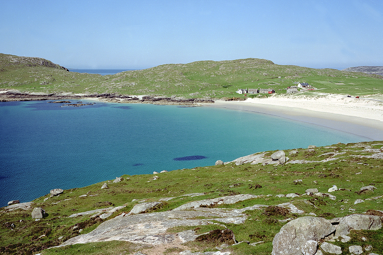 Crofts overlooking a remote beach and bay in the Outer Hebrides 