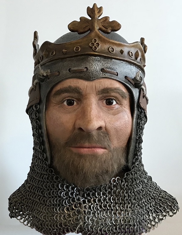 A digital model of Robert the Bruce's face and head. He is depicted with a trimmed beard and wears a crown and chainmail. 