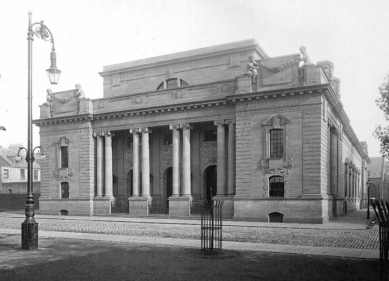 An archive photo of Perth City Hall with a grand façade and an entrance flanked by eight large columns.