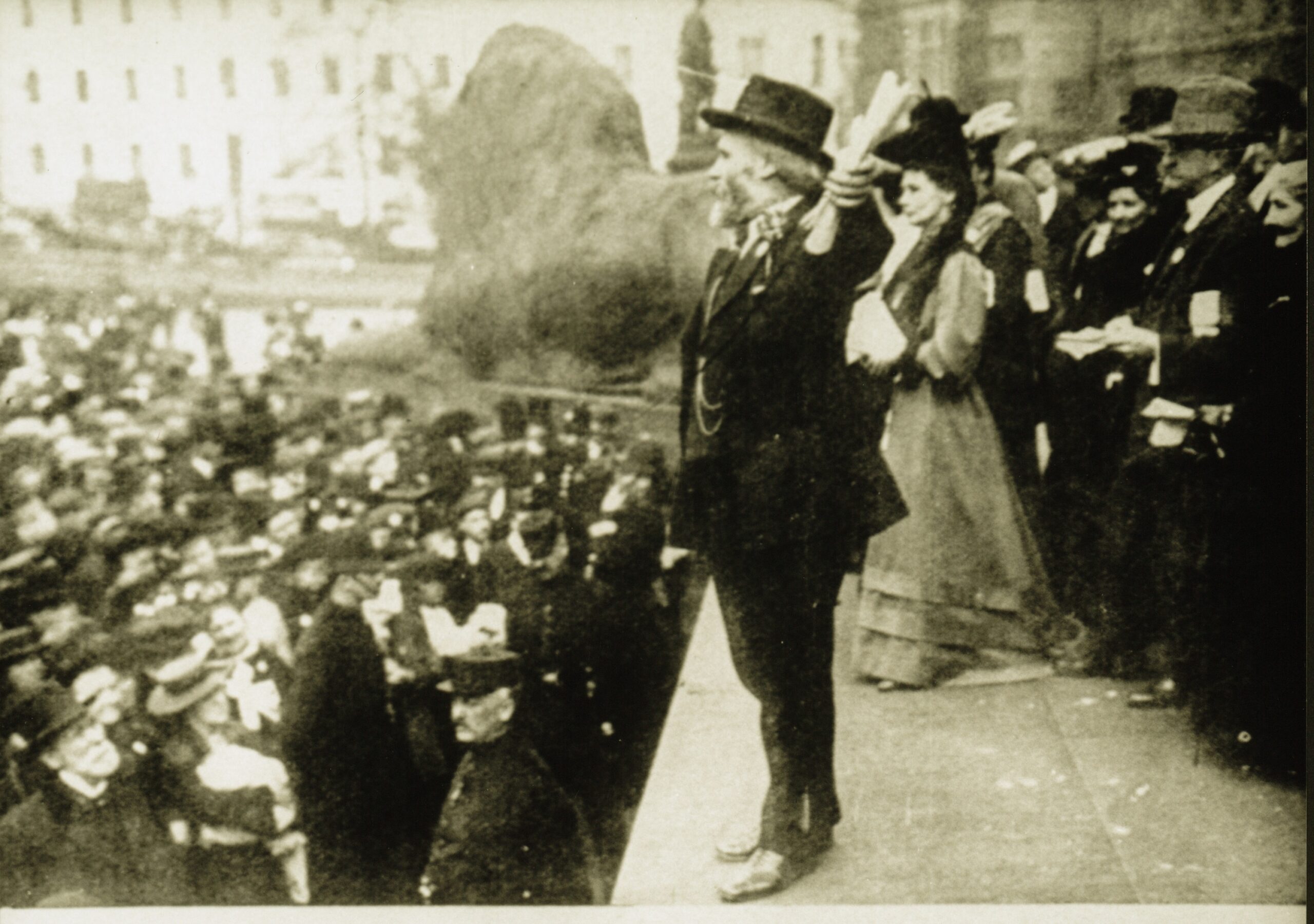 Black and white photo of Keir Hardie and Emmeline Pankhurst addressing a crowd.