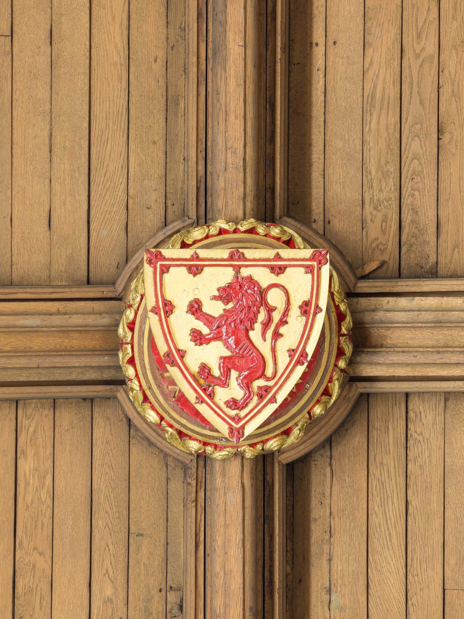 The red lion standing on its hind legs, on a golden background. The crest is on the ceiling