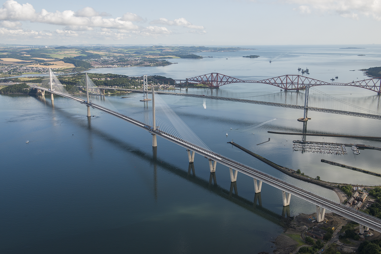 An aerial photograph of the three large bridges which span the Firth of Forth.