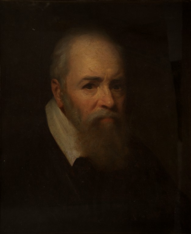 A portrait of a middle-aged man with white hair and a big bushy beard. 