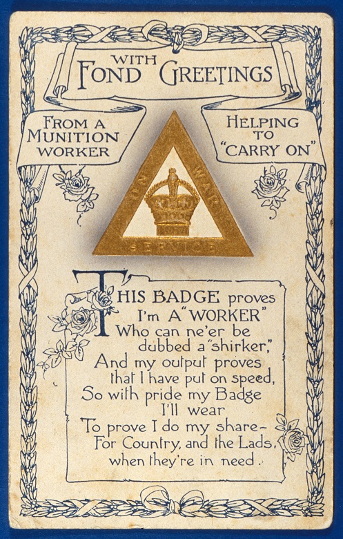 A Christmas card with a design featuring a gold triangular badge worn by munitions workers. Beneath the badge there is a short poem which reads: "This badge proves I'm a worker who can ne'er be dubbed a "shirker", And my output proves that I have put on speed, So with pride my Badge I'll wear To prove I do my share - For Country, and the lads, when they're in need"