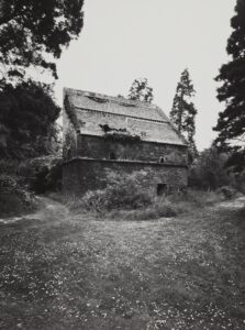 Black and white archive photo of an aged rectangle doocot.