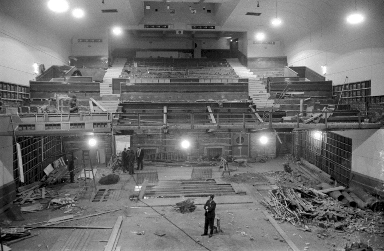 Black and white archive image of the inside of the Dominion cinema while it was being renovated. There is a man standing in the auditorium.