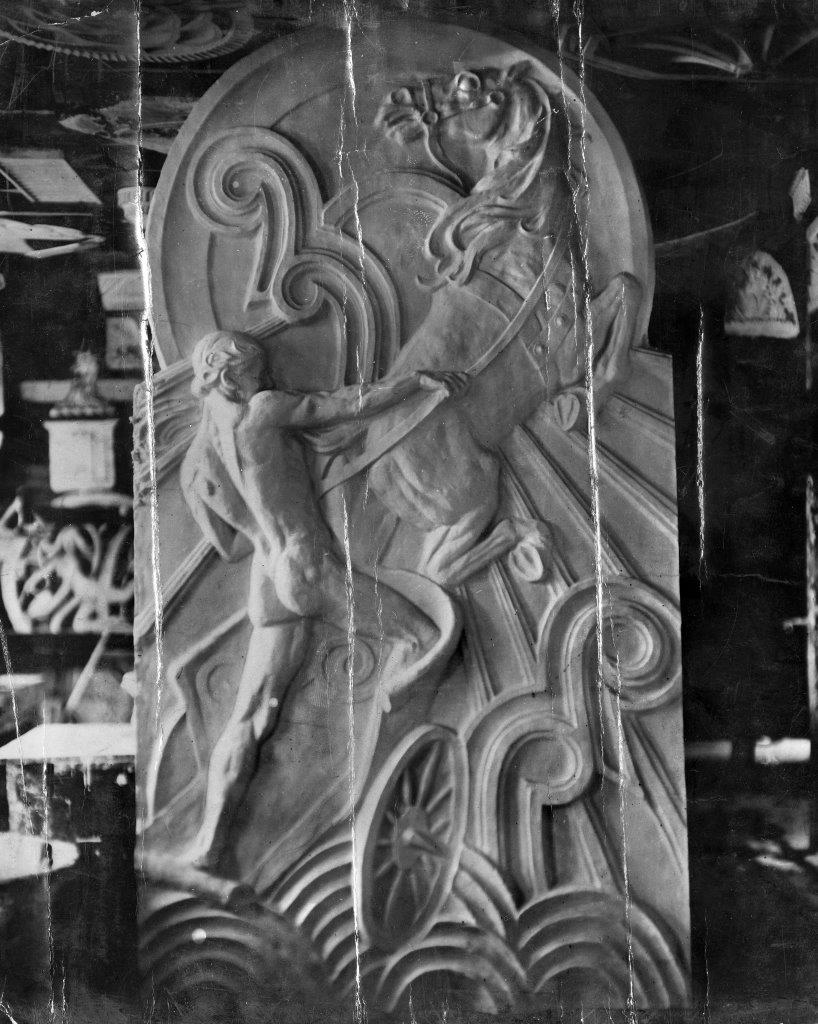 Black and white archive image of a naked charioteer on a horse carved in stone