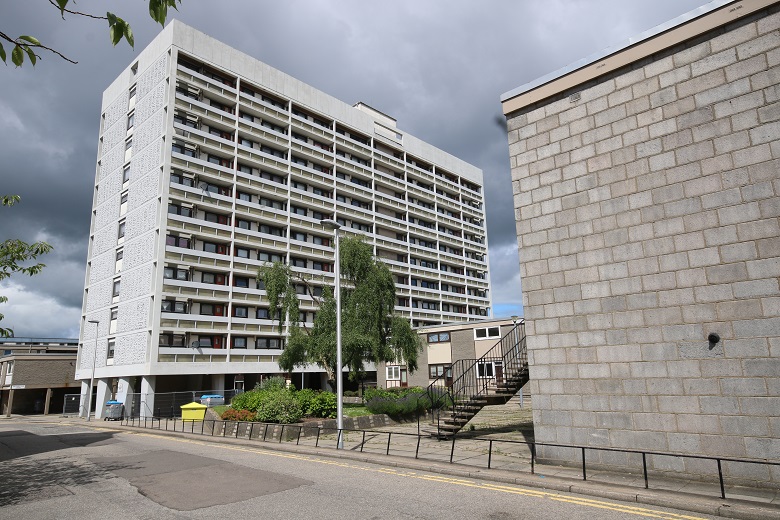 A brutalist high rise block of flats.
