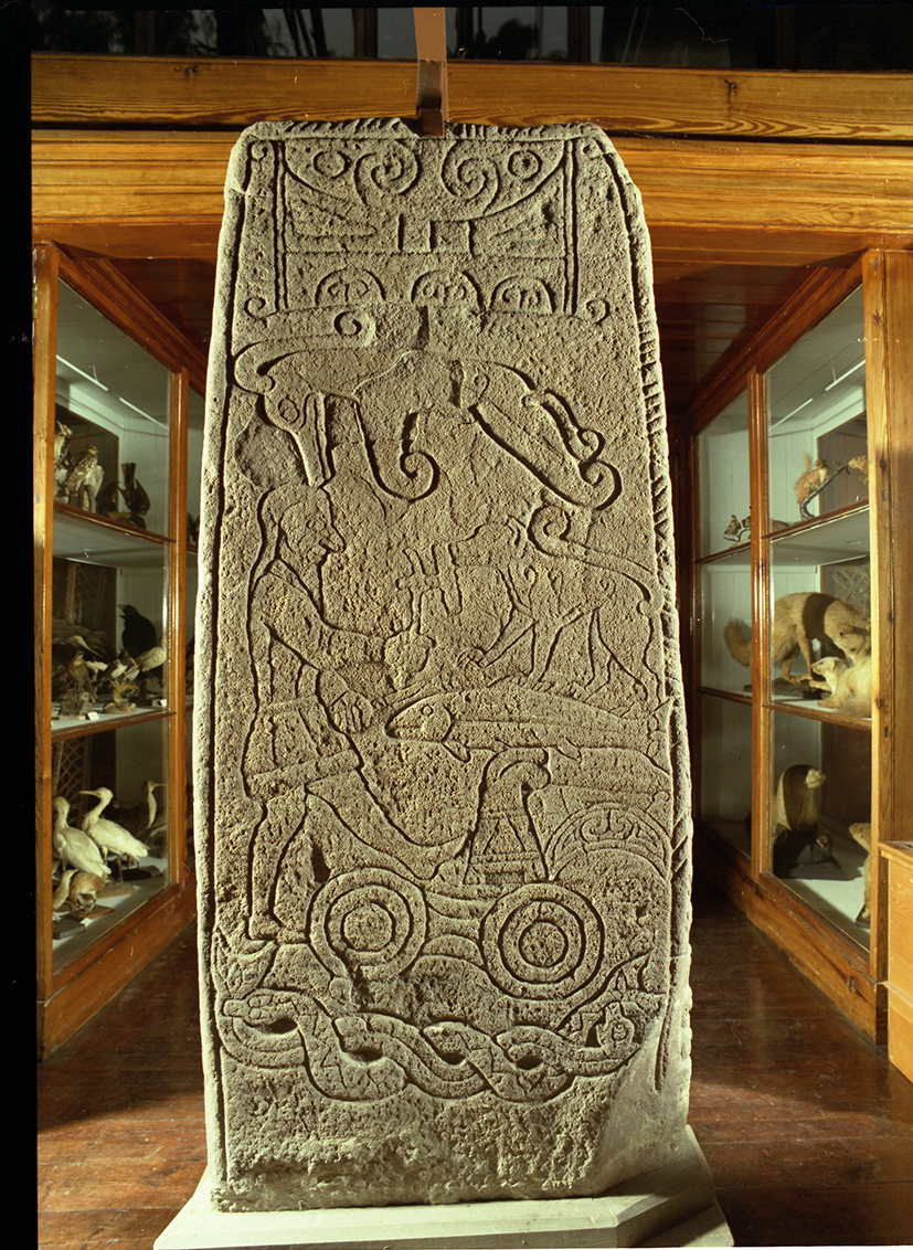 elaborately carved stone with human and animal figures