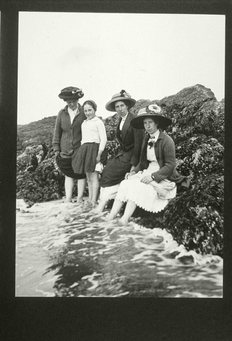 black and white archive photo showing three women wearing summer dresses