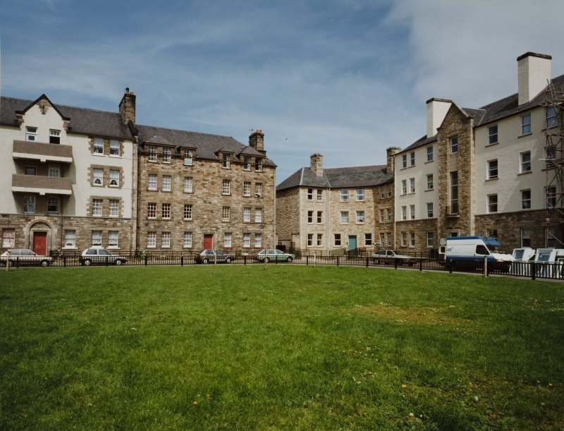 Piershill, Edinburgh. There are several houses lined up in a square, with grass in the middle.