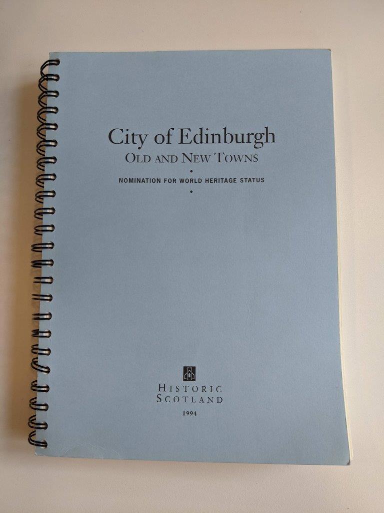 A document with a pale blue cover that says ‘City of Edinburgh, Old and New Towns, nomination for World Heritage Status, 1994’.