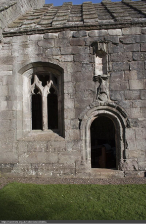 Exterior of Dunglass Church showing The priest’s door and the Home family emblem