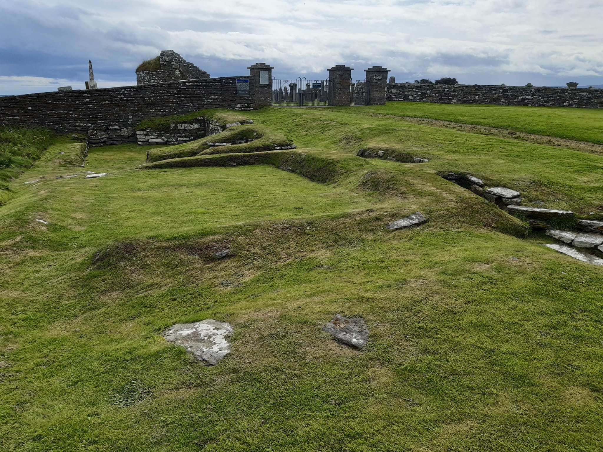 grassy area with lumps and bumps showing the outline of a building long gone, the Earl's Bu
