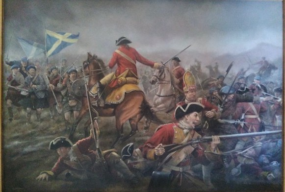A dramatic battle scene depicting soldiers in 18th-century military uniforms engaged in combat. In the foreground, troops wearing red coats and tricorn hats fight with muskets and bayonets, some crouching and aiming while others appear wounded. A mounted officer in a red coat and yellow sash rides a brown horse at the centre, gesturing toward the battlefield. Behind him, more soldiers advance in highland dress and a saltire flag is prominently visible on the left side. 