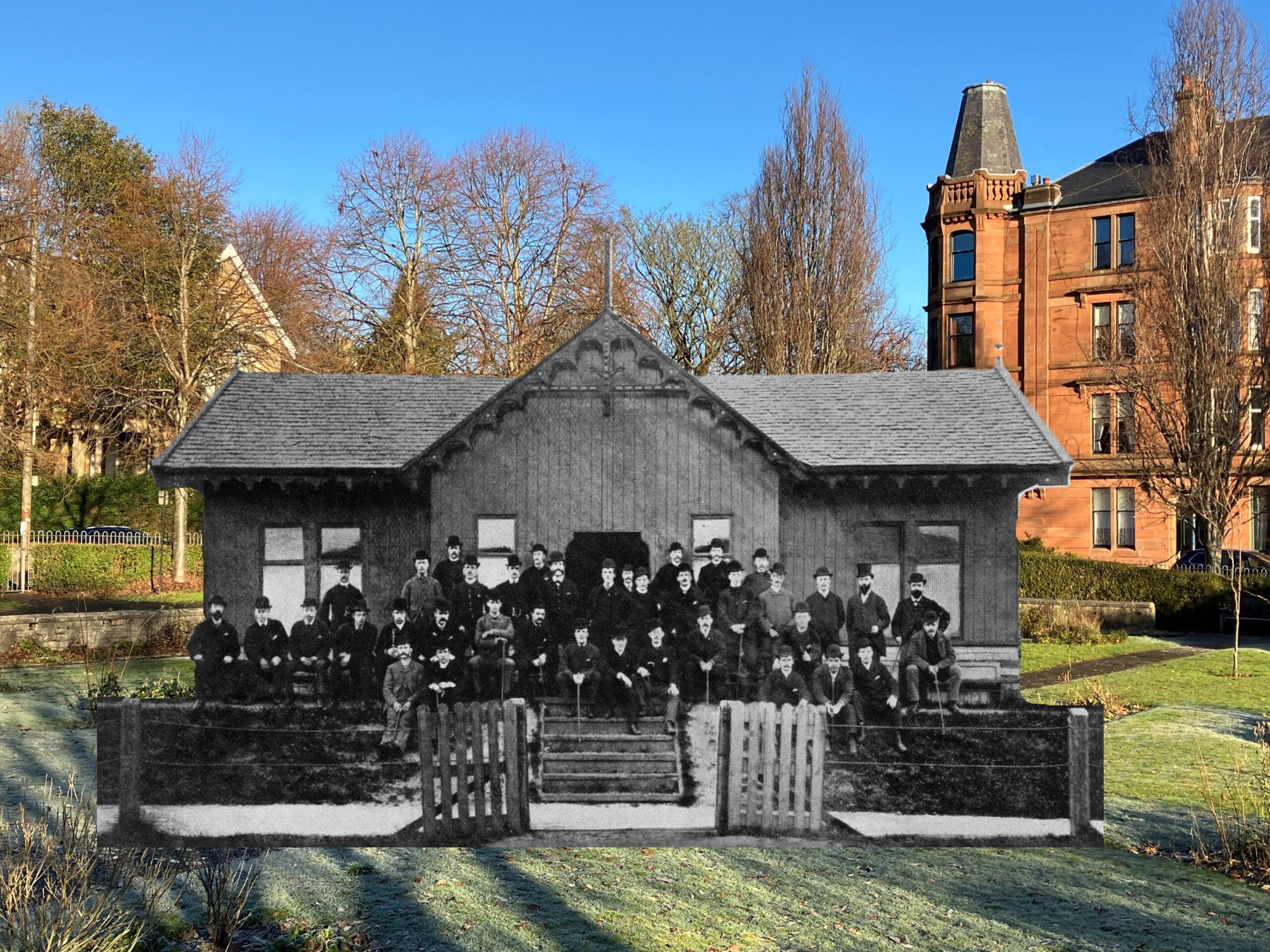Historic black and white image of men standing outside a pavilion superimposed onto a modern park with tenement buildings beside it.