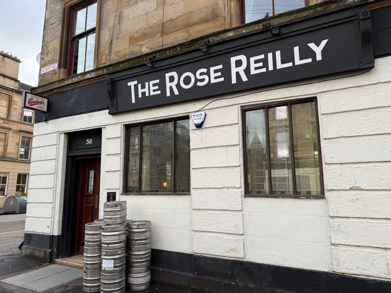 Front of The Rose Reilly pub painted black and white. 