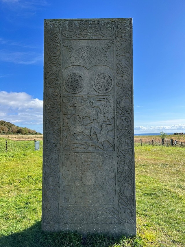 Pictish stone slab in sunlight.
